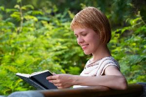 girl reading outdoors