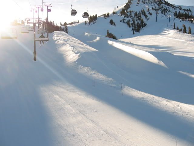 IMG_7626.jpg Thurs. 1/1/09 Ski Day #2. HAPPY NEW YEAR! A fine way to begin the new year with a few turns on perfect snow on Mammoth Mountain. Going up Chair 6 into the morning early sun. Note: hardly anyone on the hill yet. <img class=